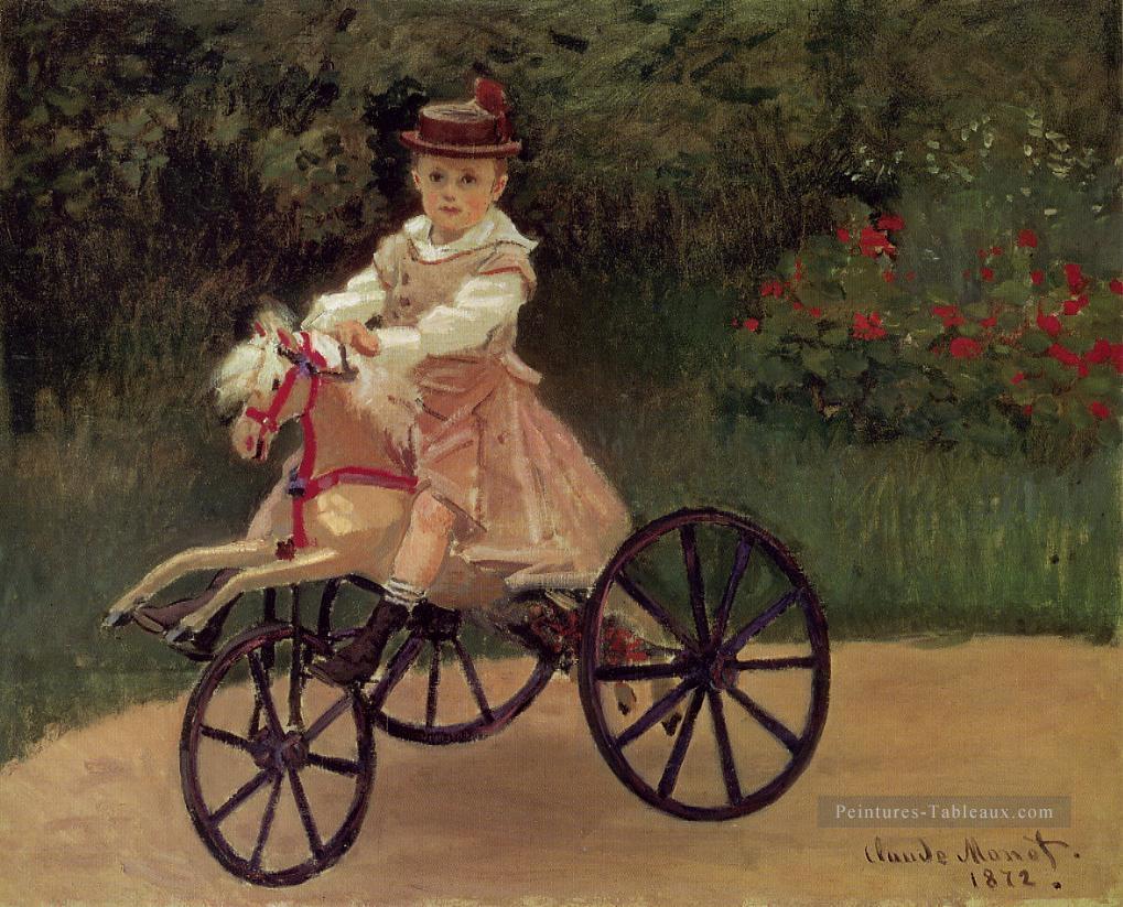Jean Monet sur son tricycle à cheval Claude Monet Peintures à l'huile